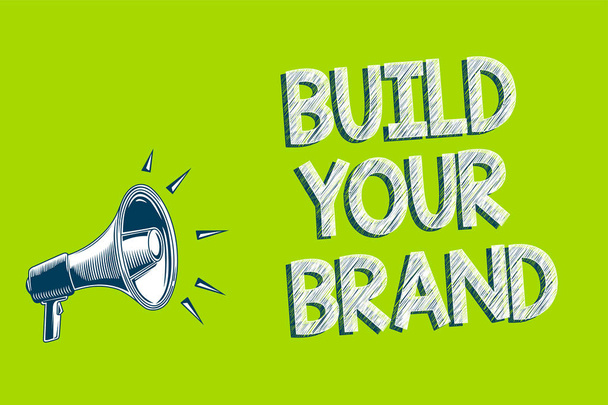 Writing note showing Build Your Brand. Business photo showcasing Make a commercial identity Marketing Advertisement Artwork convey message speaker alarm announcement green background - Photo, Image