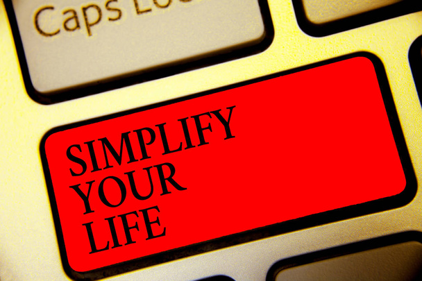 Conceptual hand writing showing Simplify Your Life. Business photo text Manage your day work Take the easy way Organize Symbol computer idea script capital typing keyboard input button - Photo, Image