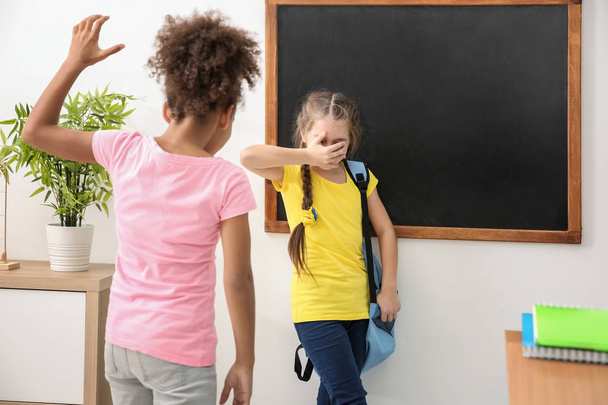Girl bullying her classmate in school - Fotoğraf, Görsel