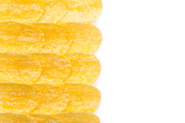 Crispy potato chips isolated on white background - Foto, Imagen