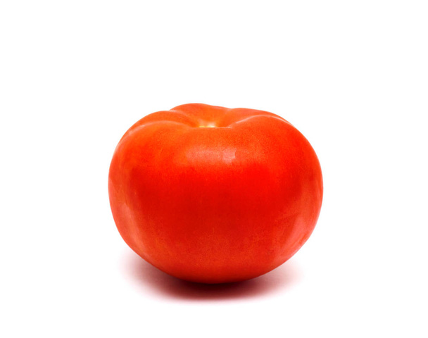 Fresh red tomato close up on a white background, isoalted - Foto, afbeelding