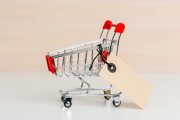 empty shopping cart on wooden background - Фото, зображення