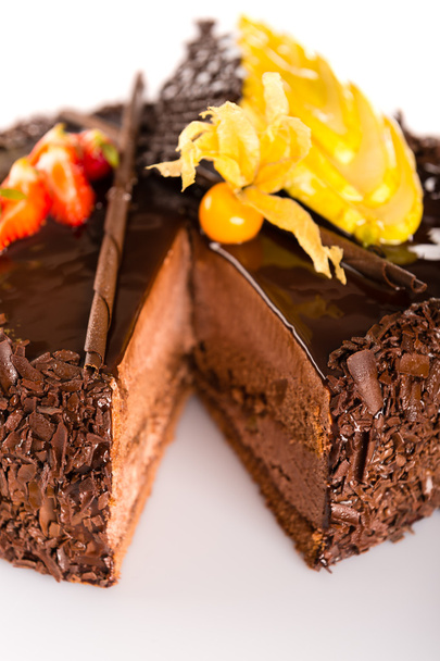 Rich chocolate cake with fruit decoration - Фото, изображение
