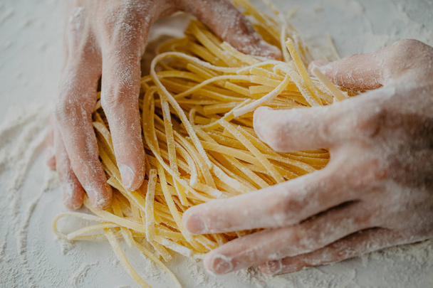 Closeup of process of making cooking homemade pasta. Chef make fresh italian traditional pasta  - Fotoğraf, Görsel