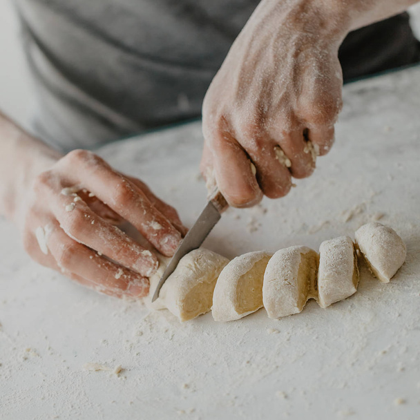 Process of cutting dough making dish cooking homemade dough. Chef makes fresh dough  - Foto, immagini