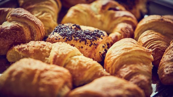 Lot of croissant on the table of bar - Photo, Image