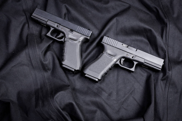 handguns on black background, close up - Fotoğraf, Görsel