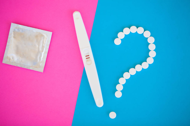 Pregnancy test. The result is positive with two strips. Treatment of infertility with pills, help in conceiving a child. Tablets from pregnancy do not work, contraception. - Photo, Image