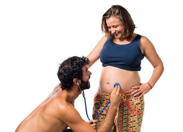 Отец и беременная мать вместе со стетоскопом
 - Фото, изображение