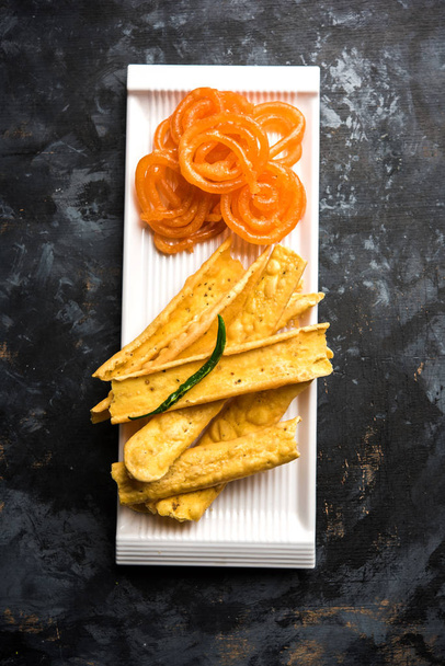 Crispy Fafda with sweet jalebi is an Indian snack most popular in Gujarat, selective focus - Photo, image