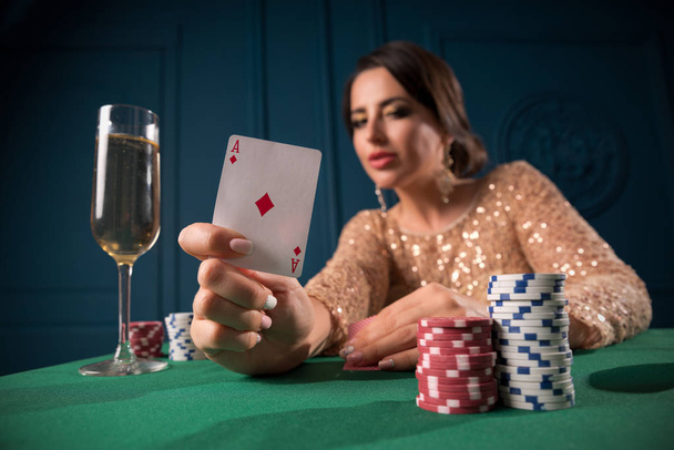 Young woman playing in the casino - Foto, imagen