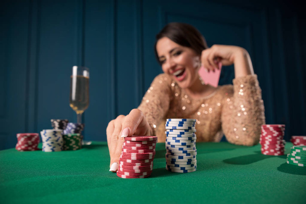 Young woman playing in the casino - Foto, imagen