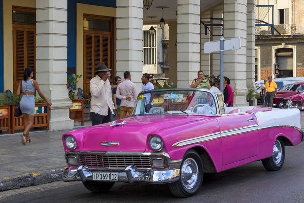 Havana, Cuba - 02 16 2018: Vintage classic American cars in restored condition - provide transport for tourism - Фото, изображение