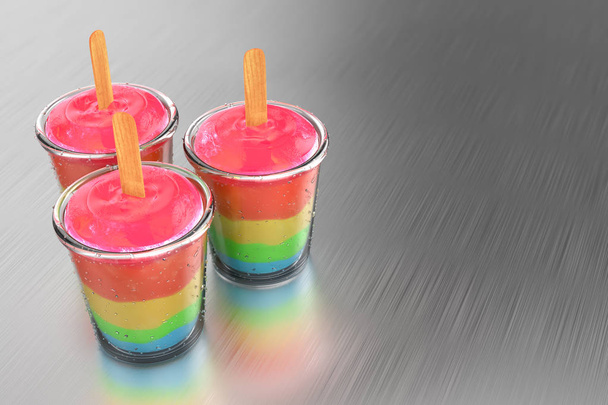 3d rendering of a group of rainbow pudding popsicles with glass cup on brush metal background. - Foto, imagen