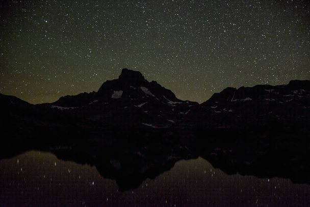 Banner Peak and stars reflecting on Thousand Island Lake at night, Ansel Adams Wilderness, California. - Photo, Image