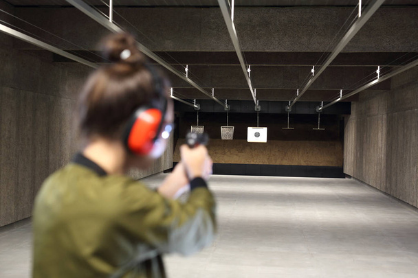 Shooting range. Measuring to a paper target on the shooting range. - Photo, Image