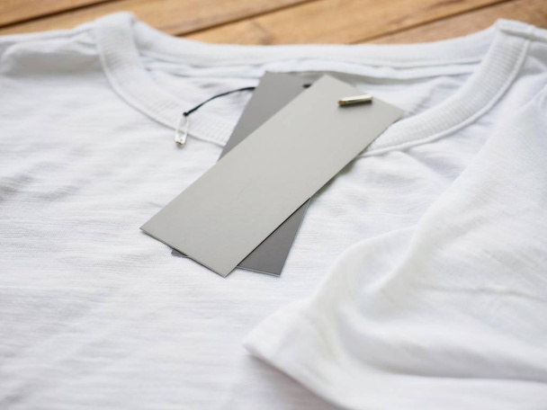 White round t-shirt and clothing label - Zdjęcie, obraz