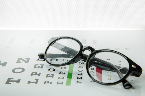 Diagram of checking eyes glasses medical background. - Photo, Image