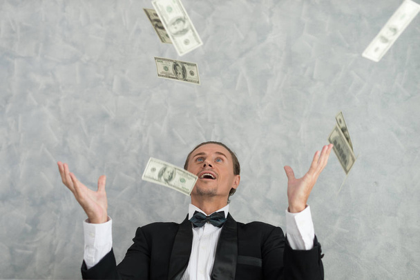 Young businessmen who are successful in business, with many banknote dollars money. business success concept - 写真・画像