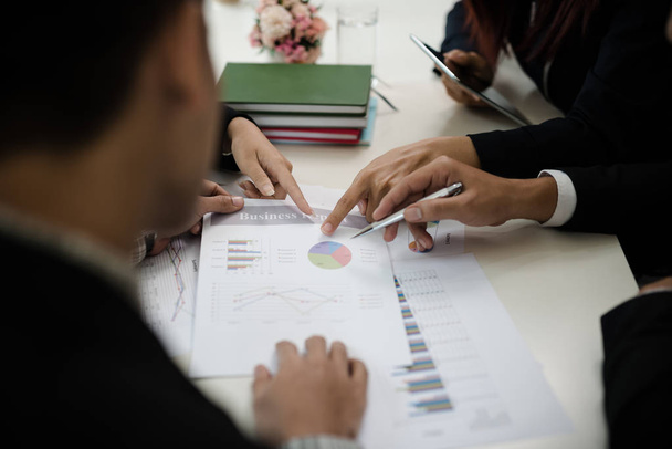 A group of business men and women are meeting together to see graphs about business marketing sales target. teamwork business meeting, business finance and accounting.concept - Foto, Imagem