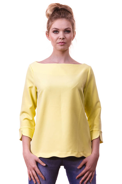 Adult woman presenting her casual beautiful outfit, long sleeved yellow top and jeans. - Photo, Image