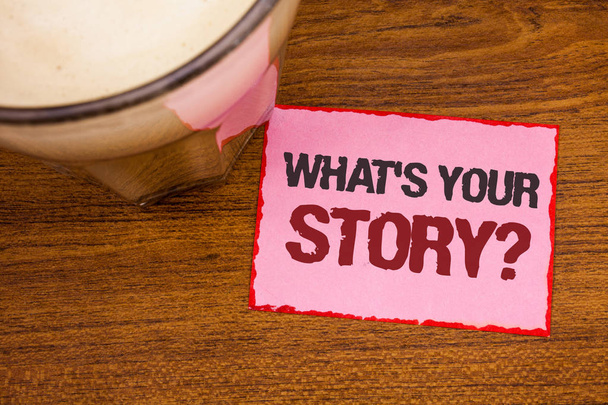 Conceptual hand writing showing What'S Your Story Question. Business photo text Connect Communicate Connectivity Connection Wooden desktop red lined pink paper with several texts coffee mug - Photo, Image