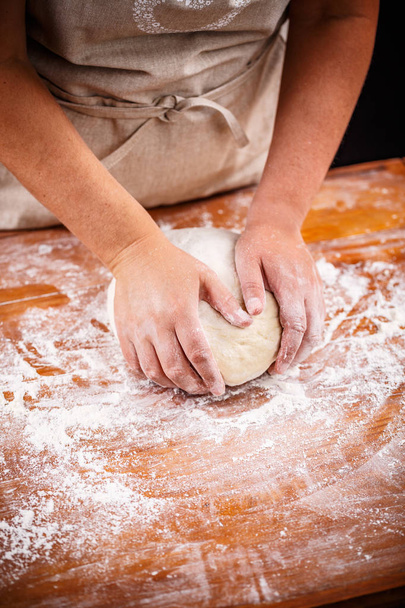 Female hands kneading and making bread dough - Φωτογραφία, εικόνα