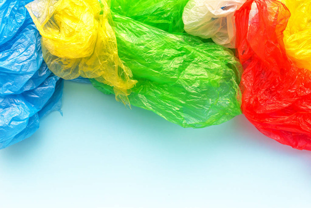 Pile of colorful plastic bags, consumerism and environmental pollution concept - Фото, изображение