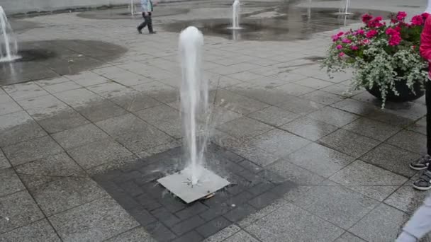 small fountain water squirt flow pavement kids play - Footage, Video