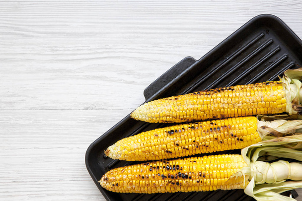 Grilled corn on the cob in a grilling pan, top view. Copy space. - Photo, Image