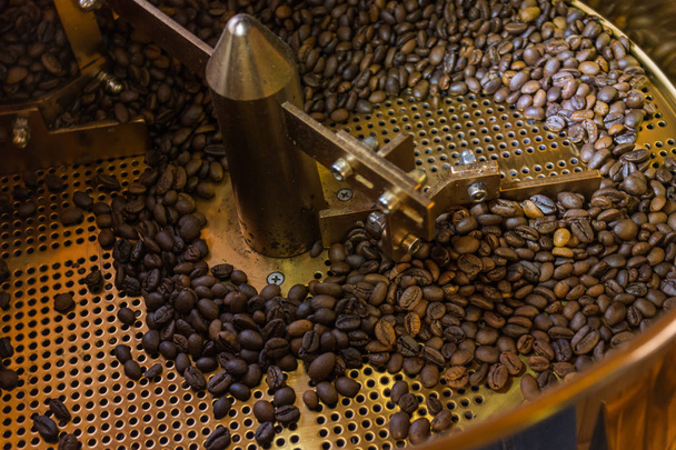 Coffee beans are roasting in  a machine. - Photo, Image