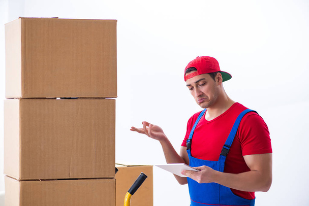 Contractor worker moving boxes during office move - Photo, Image