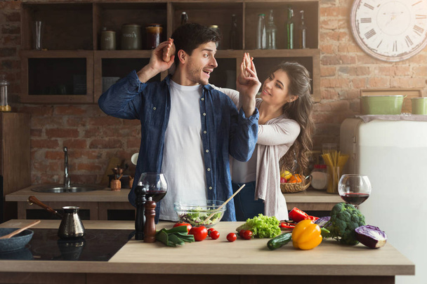 Happy couple cooking healthy food together - Photo, Image