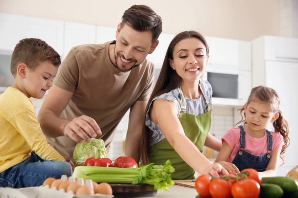 Happy family with children together in kitchen - Fotografie, Obrázek