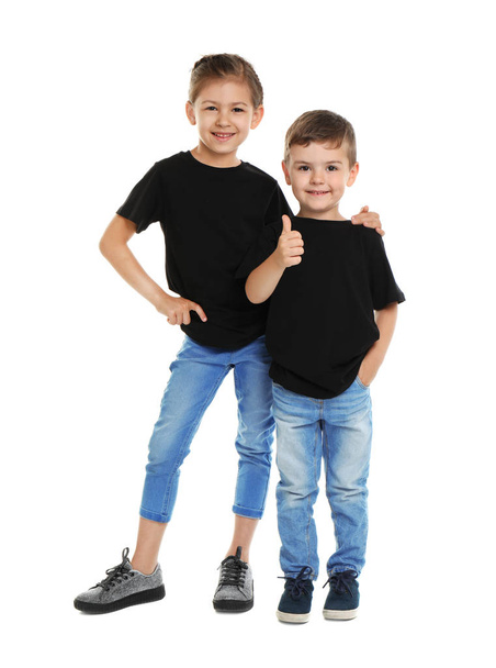 Little kids in t-shirts on white background. Mockup for design - Photo, Image