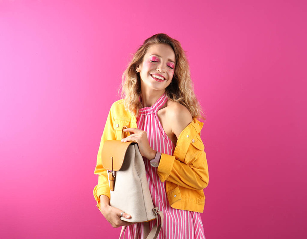 Beautiful young woman posing on color background. Summer fashion - Valokuva, kuva