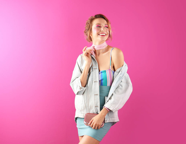 Beautiful young woman posing on color background. Summer fashion - Φωτογραφία, εικόνα