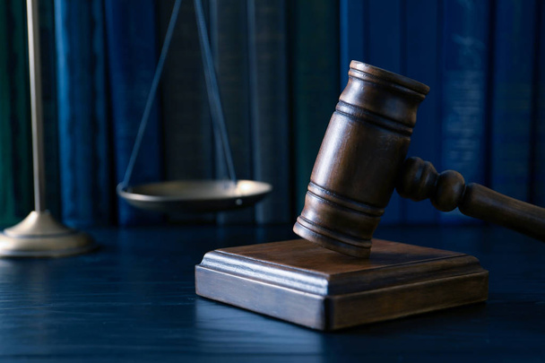 Wooden gavel, scales of justice and books on table, closeup. Law concept - Photo, image