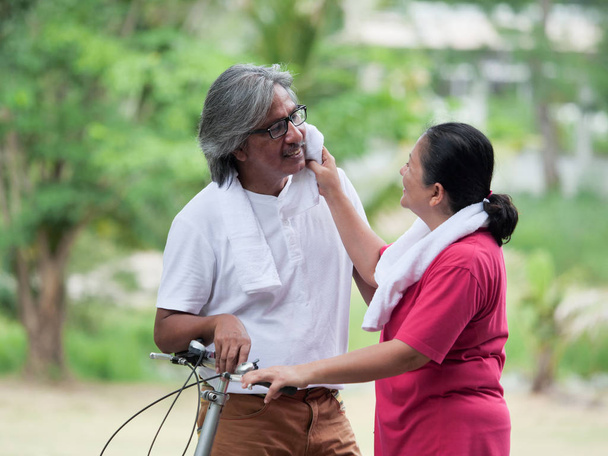 Senior couple lover cyling in Park.Health care concept. - Photo, Image