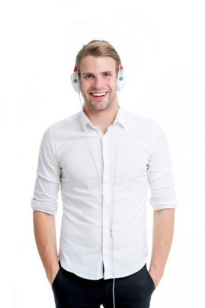 Music always with me. Man listening music headphones. Guy with earphones listens music. Man satisfied happy smiling face enjoy listening music headphones isolated white background - Foto, Imagen