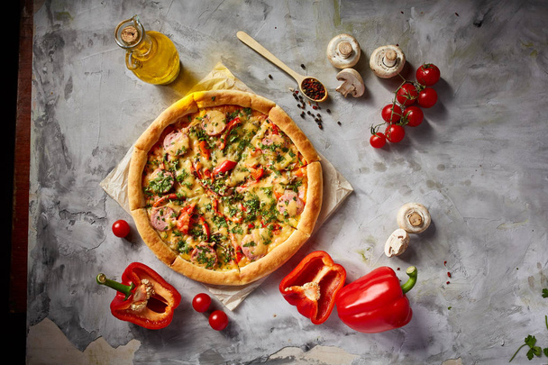 Tasty Italian pizza and its ingredients on white textured background. - Фото, зображення