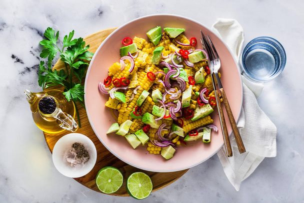 grilled corn , avocado salad with blue onion and chili pepper. healthy summer breakfast or lunch - Photo, Image