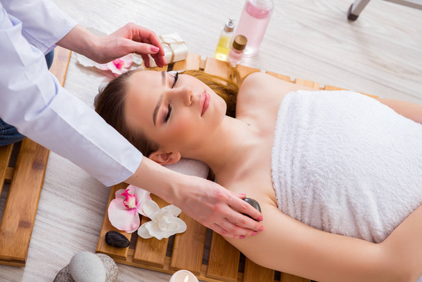 Young woman during spa procedure in salon - Photo, Image