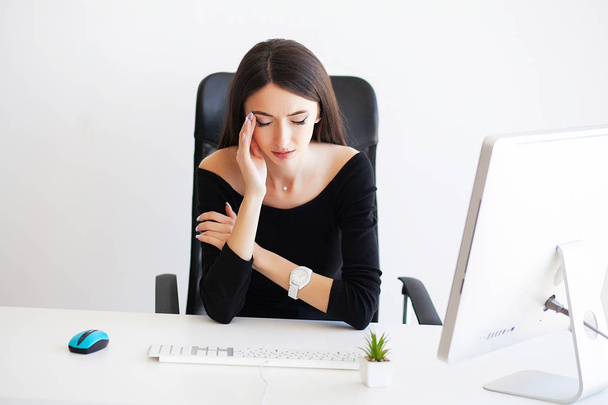 Beautiful Businesswoman suffering pain on her office. - Photo, image