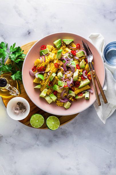 grilled corn , avocado salad with blue onion and chili pepper. healthy summer breakfast or lunch. copy space - Photo, Image