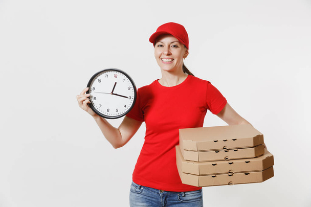 Woman in red cap, t-shirt giving food order pizza boxes isolated on white background. Female pizzaman courier dealer holding round clock, italian pizza in cardboard flatbox. Delivery service concept - Photo, Image