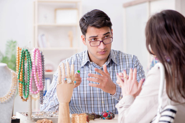 Woman visiting jeweler for jewelery evaluation - Photo, Image