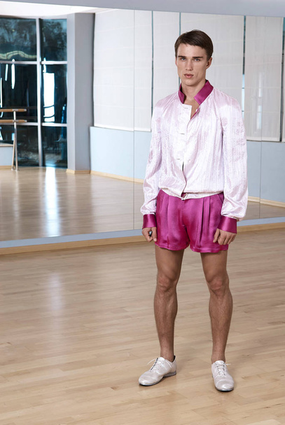 High fashion young sexy man in pink shorts and a white jacket. - Foto, immagini