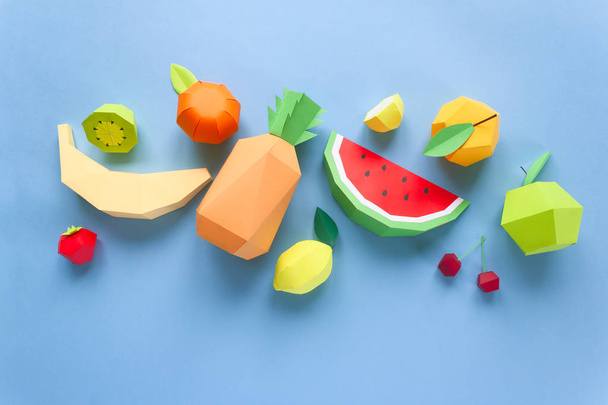 exotic fruits made of paper on blue background - Photo, image