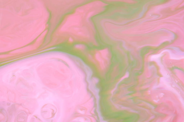 Pink green holographic background, pink water droplets, multicolored pattern, food colors in milk, color texture on the water, blank for the designer - Fotoğraf, Görsel